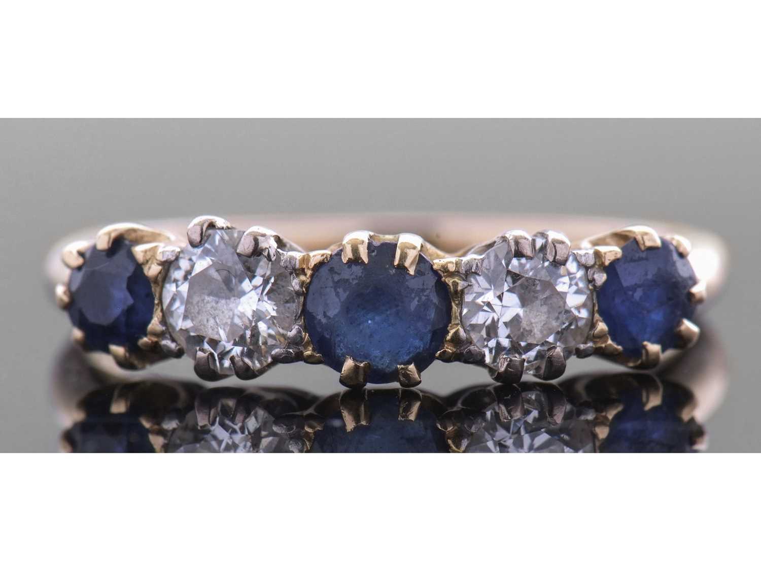 Lot 194 - Sapphire and diamond five stone ring,...
