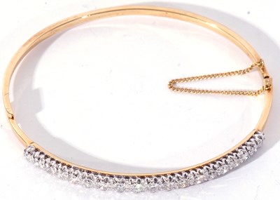 Lot 202 - 18ct gold and diamond hinged bracelet of oval...