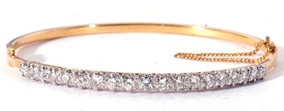 Lot 202 - 18ct gold and diamond hinged bracelet of oval...
