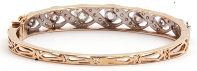 Lot 204 - Diamond set hinged bracelet, featuring seven...
