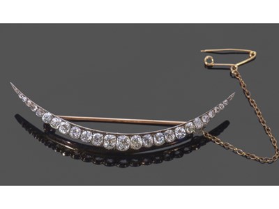 Lot 211 - Antique diamond, silver and gold crescent...