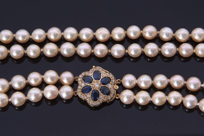 Lot 215 - Double row cultured pearl necklace with a...