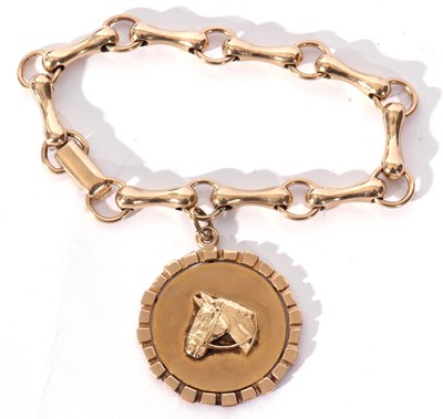 Lot 216 - 9ct gold bracelet and horse pendant, a design...