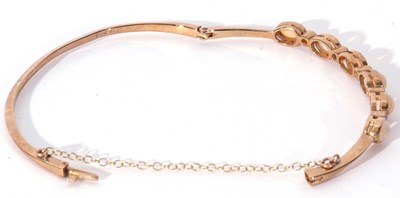 Lot 260 - 9ct gold opal and diamond set hinged bracelet,...