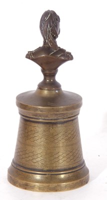 Lot 91 - Novelty brass desk bell with a figural handle...