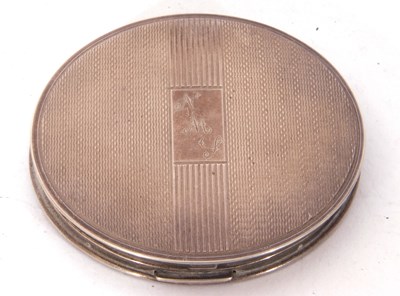 Lot 151 - George VI circular compact with banded engine...