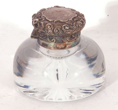 Lot 172 - Circular clear glass inkwell with star cut...