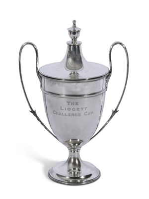 Lot 312 - George V silver trophy cup and lid with leaf...