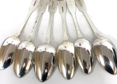 Lot 49 - 13 Georgian silver Fiddle pattern table spoons...