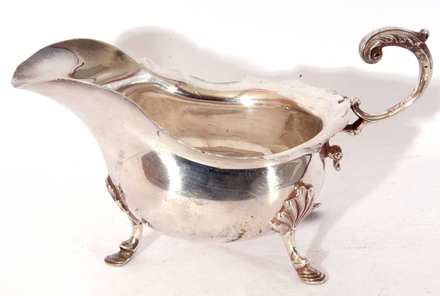 Lot 51 - Edward VII silver sauce boat of typical form,...