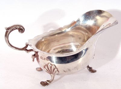 Lot 51 - Edward VII silver sauce boat of typical form,...