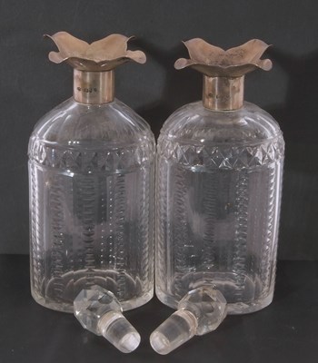 Lot 72 - Pair of late Victorian silver and glass spirit...