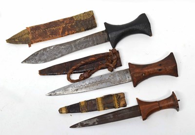 Lot 161 - Three North African daggers/knives with carved...