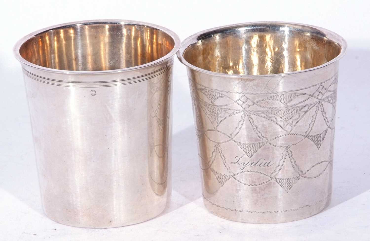 Lot 83 - Two Continental white metal beakers of...