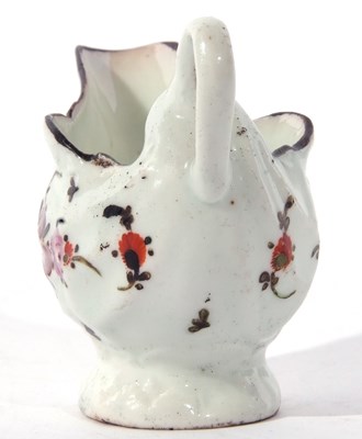 Lot 78 - A Lowestoft porcelain dolphin ewer decorated...