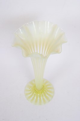 Lot 47 - Tall green vaseline glass vase with a striped...