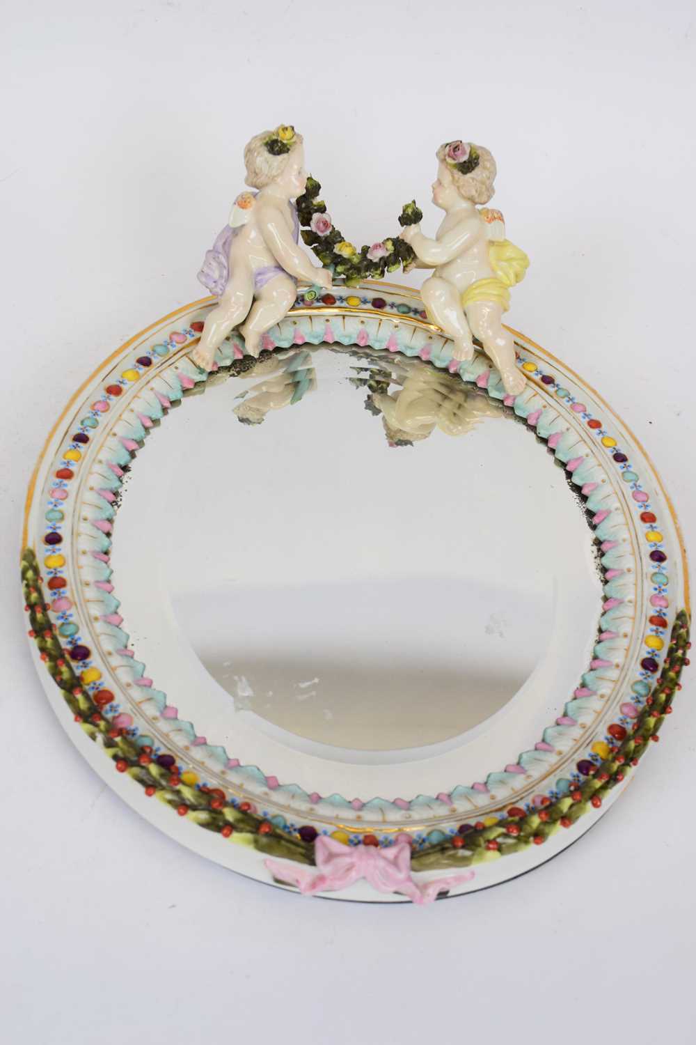 Lot 57 - Sitzendorf porcelain oval mirror with white...