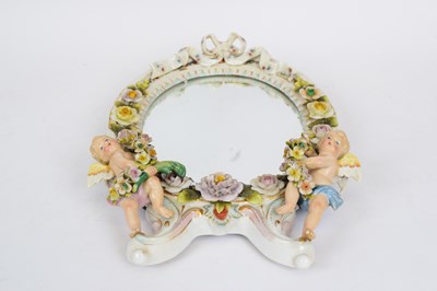 Lot 58 - Continental porcelain mirror, probably...