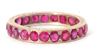Lot 21 - Small ruby set full eternity ring, size N,...