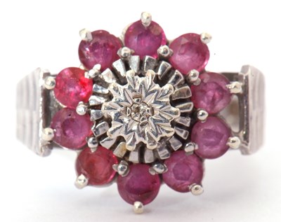 Lot 29 - 9ct white gold ruby and diamond cluster ring,...