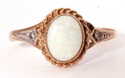 Lot 32 - 9ct gold and white opal ring, the cabochon...
