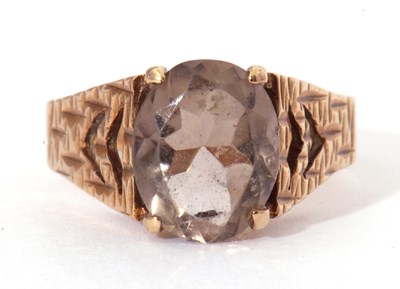 Lot 39 - 9ct gold and quartz set ring, the central oval...