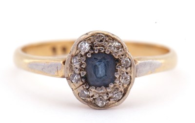 Lot 90 - Sapphire and diamond cluster ring, the cushion...