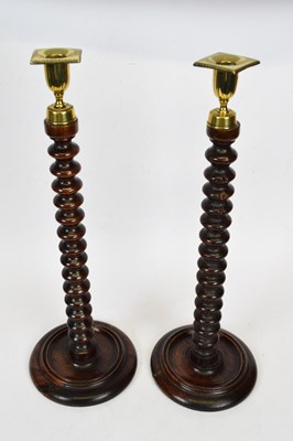Lot 117 - Pair of barley twist oak candlesticks with...