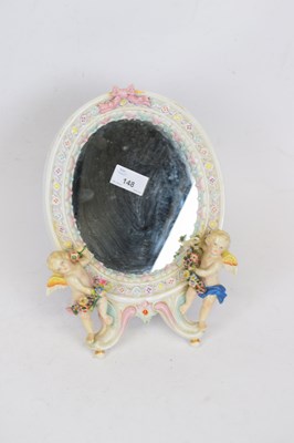 Lot 148 - Small oval mirror, Continental porcelain...