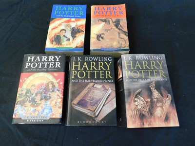 Lot 65 - Small box: J K ROWLING: 5 Harry Potter titles,...