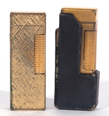 Lot 122 - Two gold plated Dunhill gas lighters, each...
