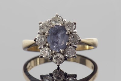 Lot 329 - 18ct gold sapphire and diamond cluster ring,...