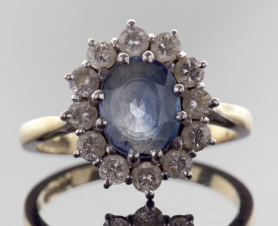 Lot 337 - 18ct gold sapphire and diamond cluster ring,...