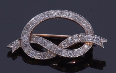 Lot 338 - Diamond tied ribbon brooch set with 40 small...