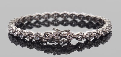 Lot 505 - Precious metal diamond set bracelet, each...