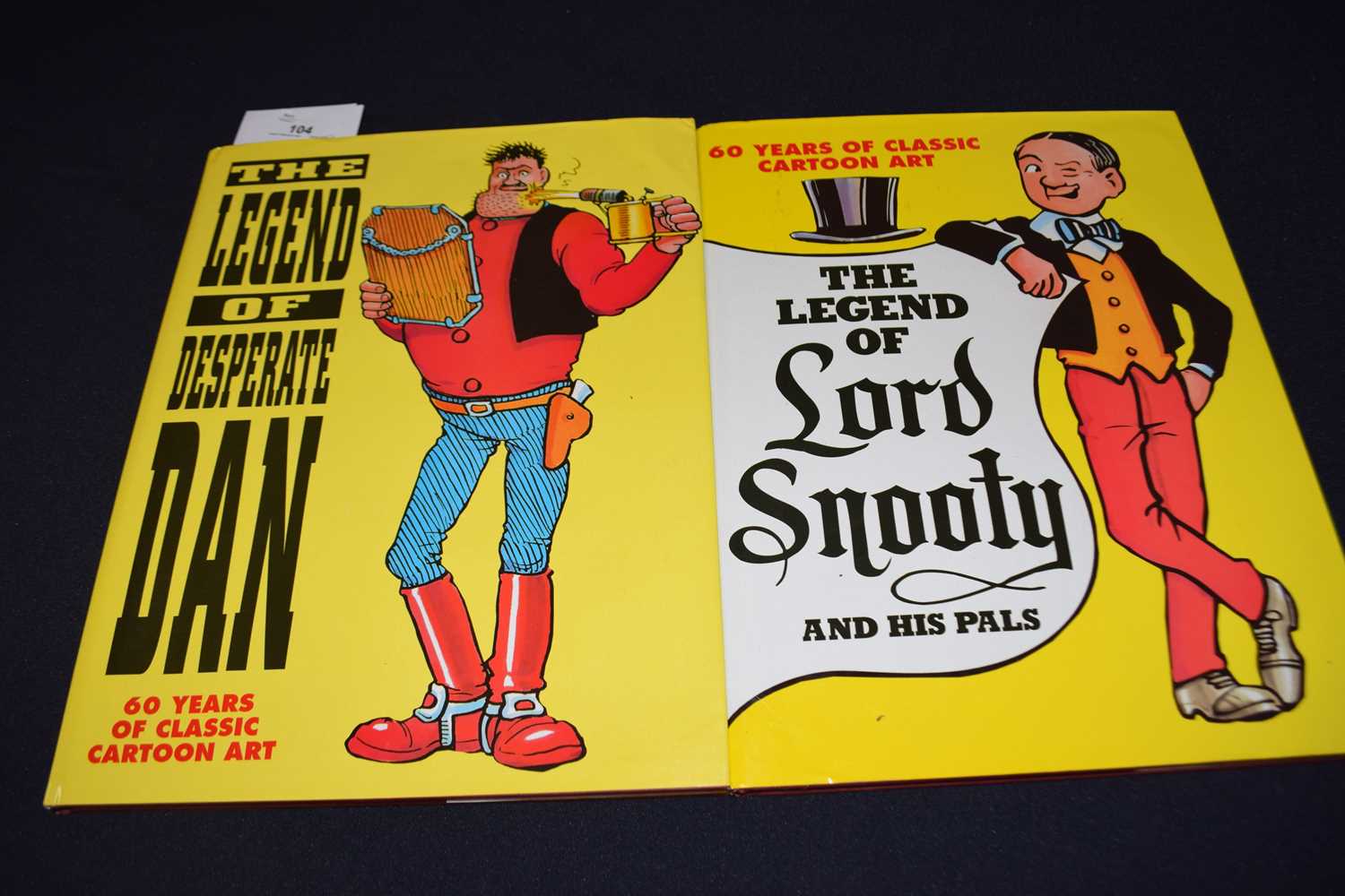 Lot 104 - 2 volumes of 60 years of classic cartoon art,...