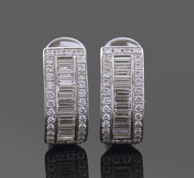 Lot 352A - A pair of 18ct white gold and diamond curved...