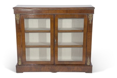 Lot 572 - Victorian walnut bookcase cabinet with two...
