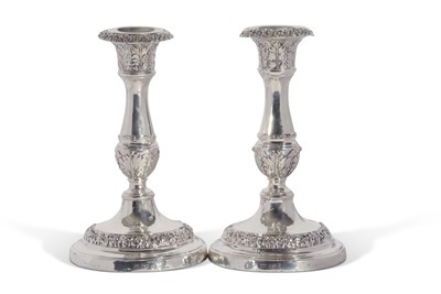 Lot 253 - A pair of George IV candlesticks with baluster...