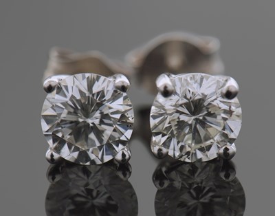 Lot 348A - A pair of Diamond stud earrings each claw set...