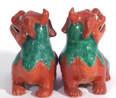 Lot 152 - Pair of Oriental Shi-Shi lions with a brown...