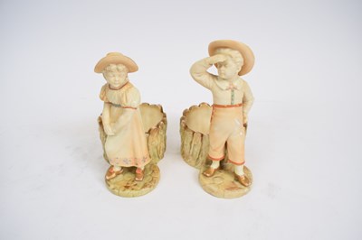 Lot 147 - Pair of Royal Worcester figures of a boy and a...