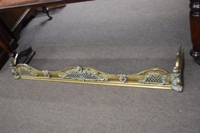 Lot 317 - Cast brass fire fender of serpentine form with...