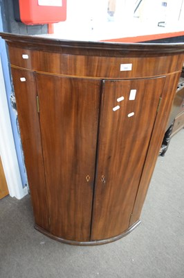 Lot 287 - Georgian mahogany two-door bow front wall...