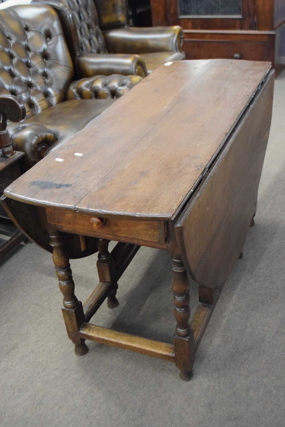 Lot 570 - 18th century oak drop leaf dining table raised...