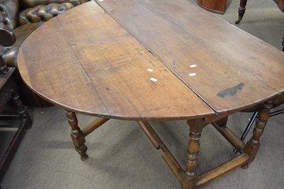 Lot 570 - 18th century oak drop leaf dining table raised...