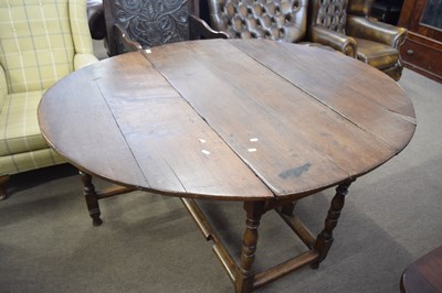 Lot 570 - 18th century oak drop leaf dining table raised...