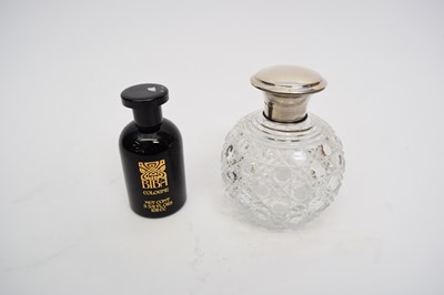 Lot 33 - Cut glass scent bottle with silver top,...