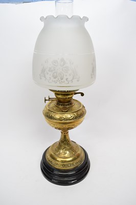 Lot 113 - Brass oil lamp with shade of floral design