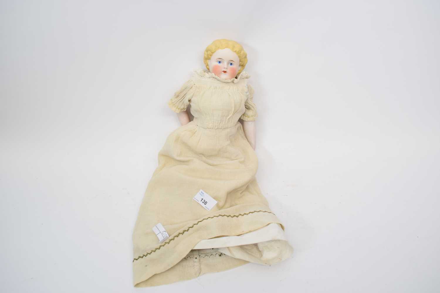 Lot 138 - Doll with ceramic head